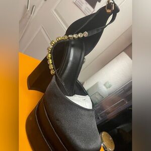 Platform black statin heel with studded straps